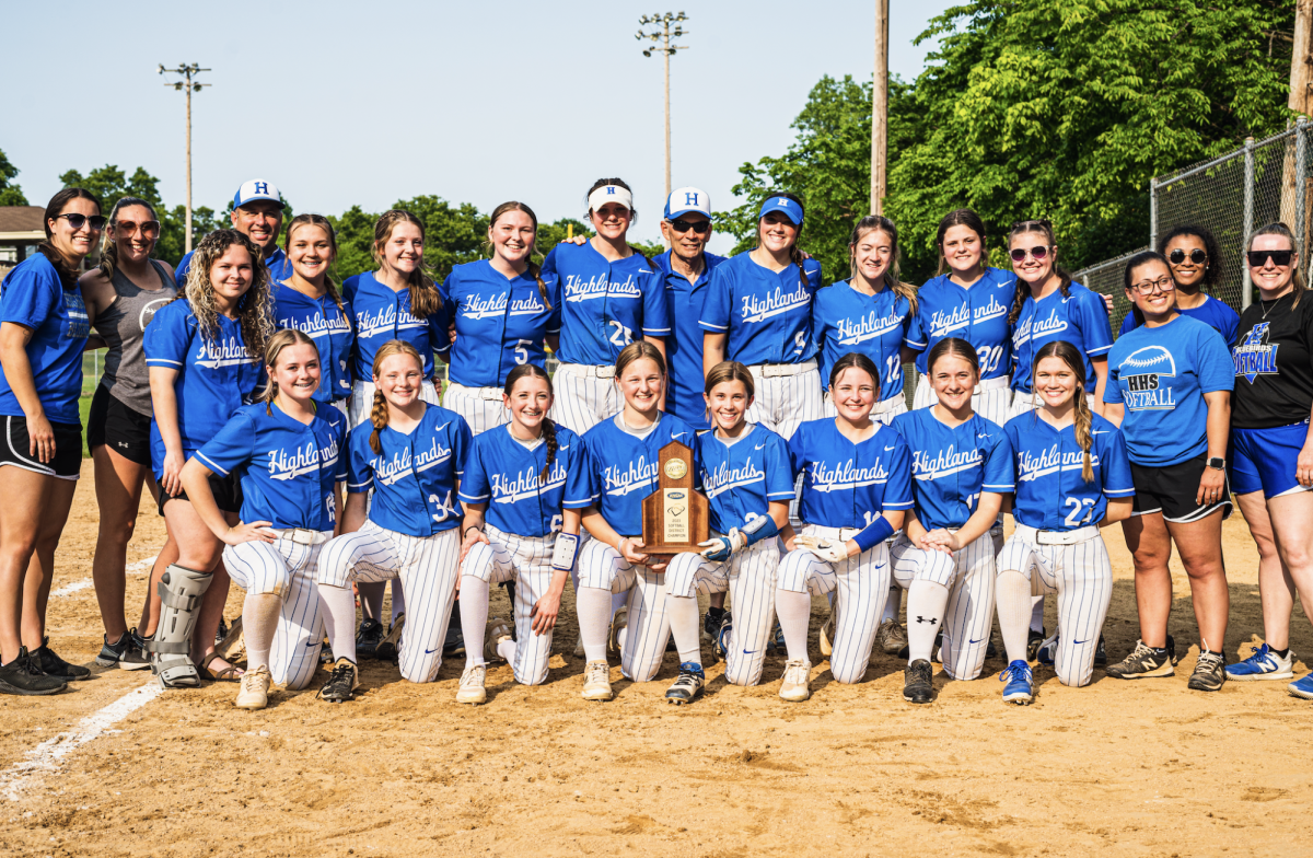 The+2022-2023+softball+team+with+the+36th+District+Championship+trophy.+